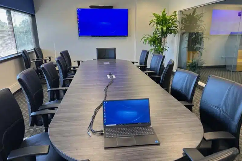 Conference Room with Screen & Laptop